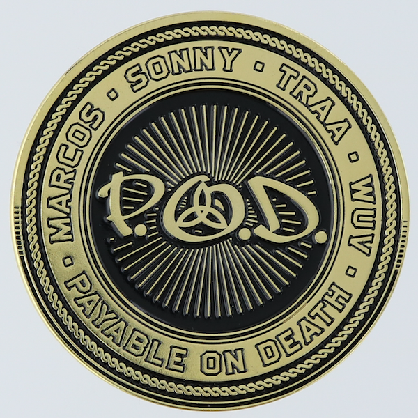 Front of a round gold challenge coin for the 20th anniversary of P.O.D.'s album Satellite.