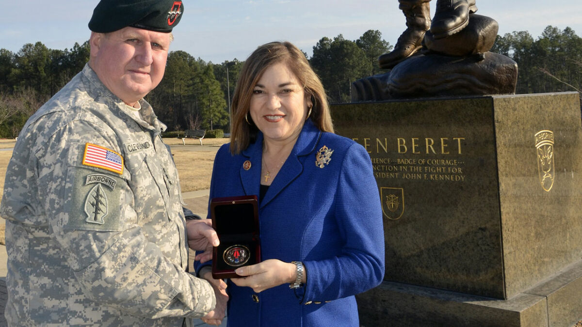 Former U.S. Rep. Loretta Sanchez (D-CA) receiving a challenge coin